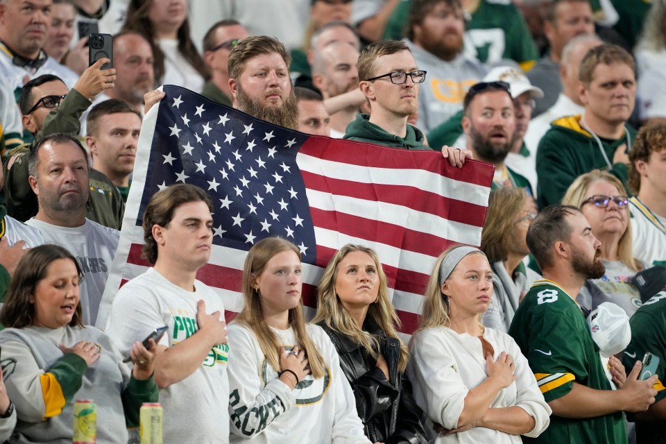GREEN BAY, WISCONSIN - SEPTEMBER 11: Fans stand for the national anthem prior to the game between the Washington Commanders and the Green Bay Packers at Lambeau Field on September 11, 2025 in Green Bay, Wisconsin. (Photo by Patrick McDermott/Getty Images)